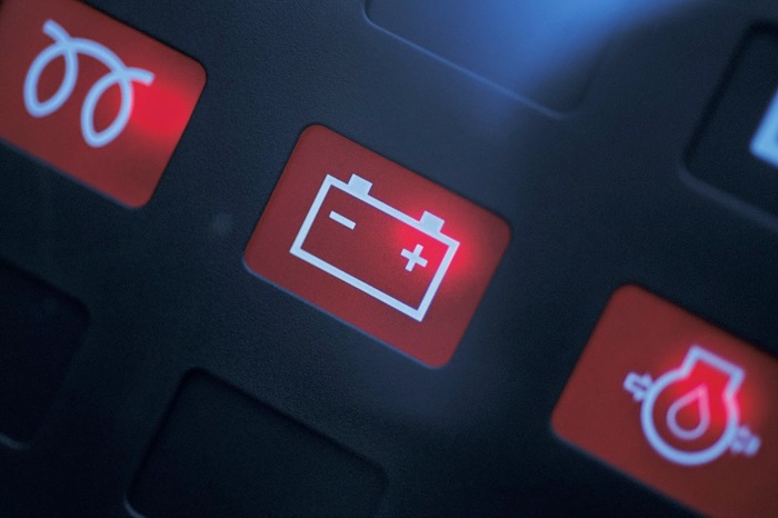 Car dashboard battery warning light illuminated - automotive electrical system warning